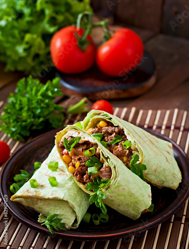 Burritos wraps with minced beef and vegetables 