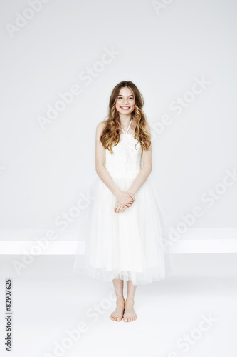 Portrait of teenage girl in white