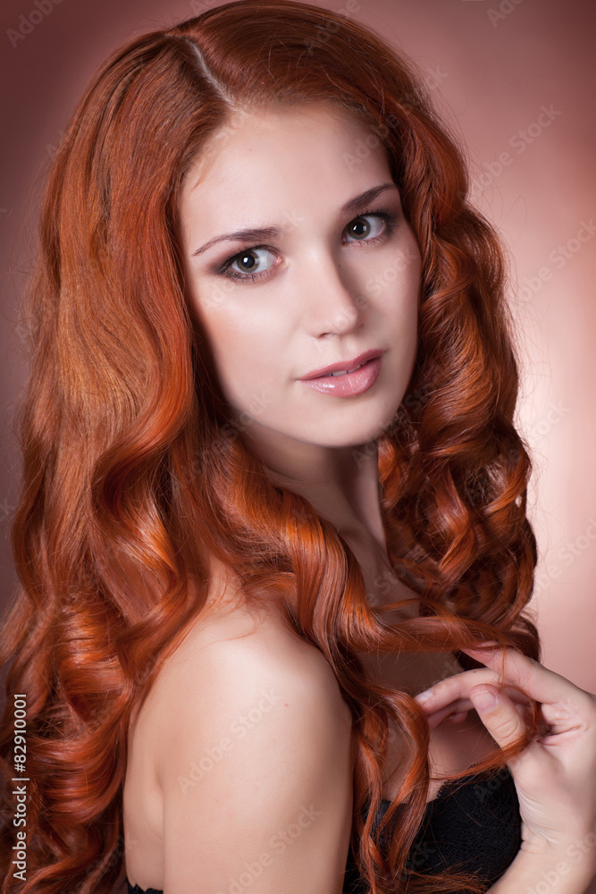 Naklejka premium Beauty woman face red hair girl studio