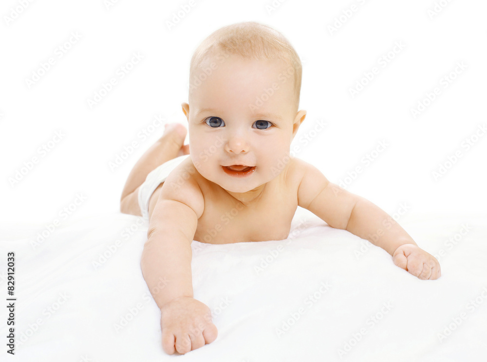 Portrait of cute infant in diapers lying on the sheet Portrait of cute infant in diapers lying on the sheet
