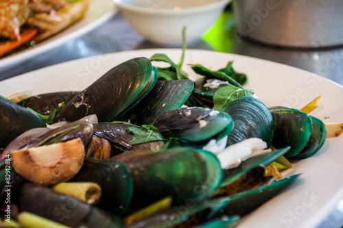 Steamed mussels with sweet basil and in Thai style photo