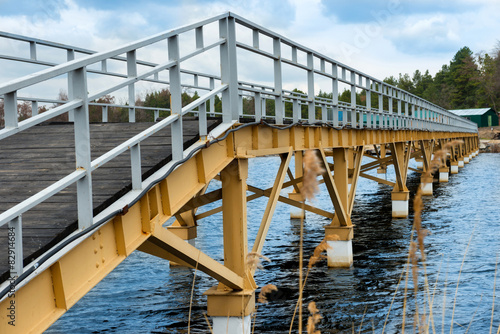 Steel bridge along river bank