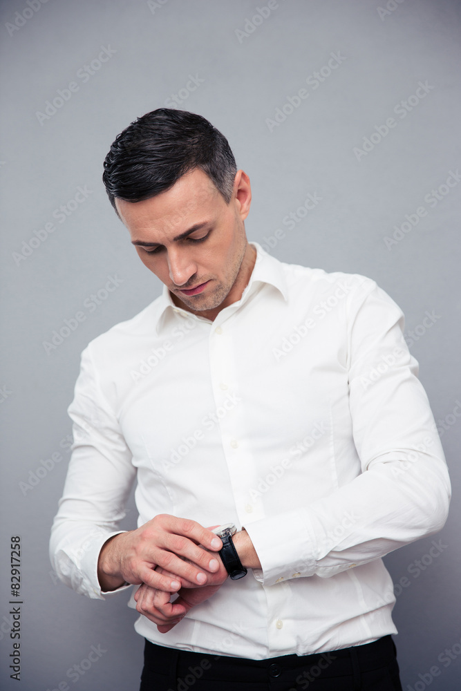 Businessman looking on wristwatch Businessman looking on wristwatch
