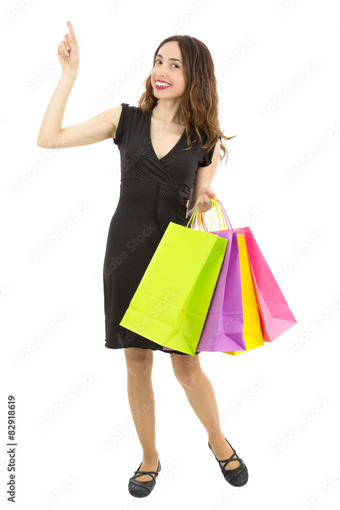 Smiling shopping woman pointing to copy space