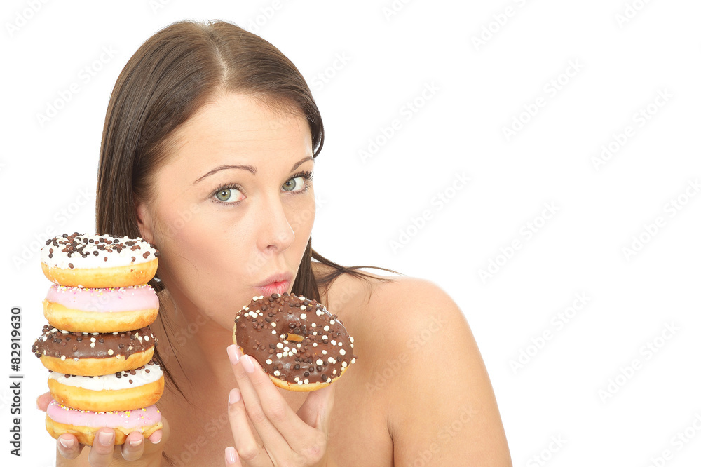 Young Woman Holding A Pile Of Colourful Iced Donuts Young Woman Holding A Pile Of Colourful Iced Donuts