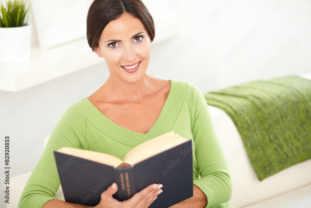 Young woman sitting inside the house Young woman sitting inside the house