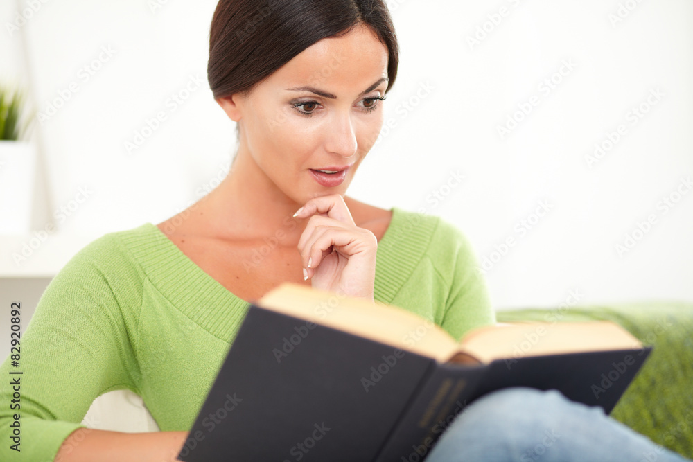 Young person reading an interesting book Young person reading an interesting book