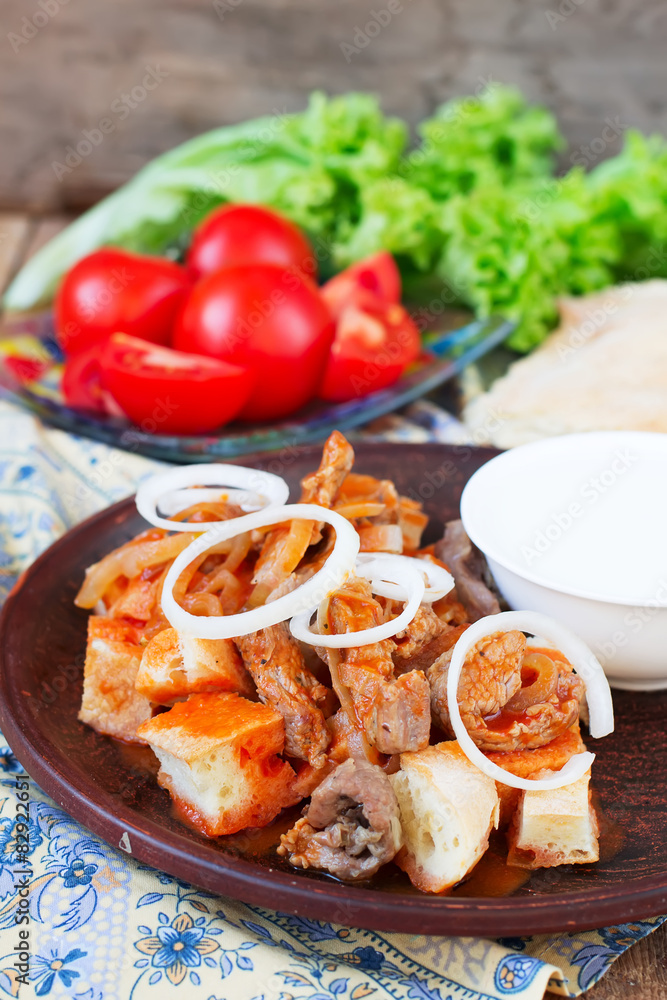Iskender kebab - traditional turkish food Iskender kebab - traditional turkish food