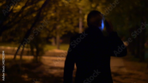 3 in 1 videos! The man walk and phone at the night city alley photo