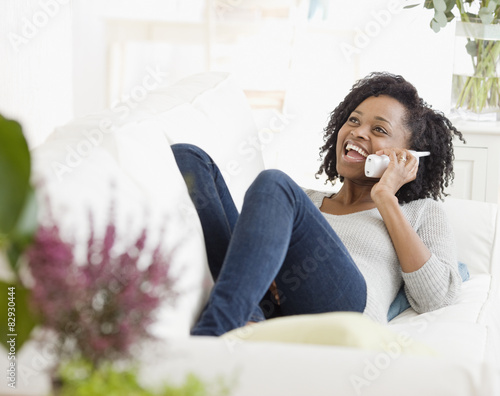 African woman talking on telephone photo