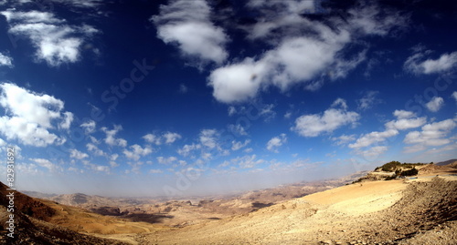 wide panorama on desert with cloudscape