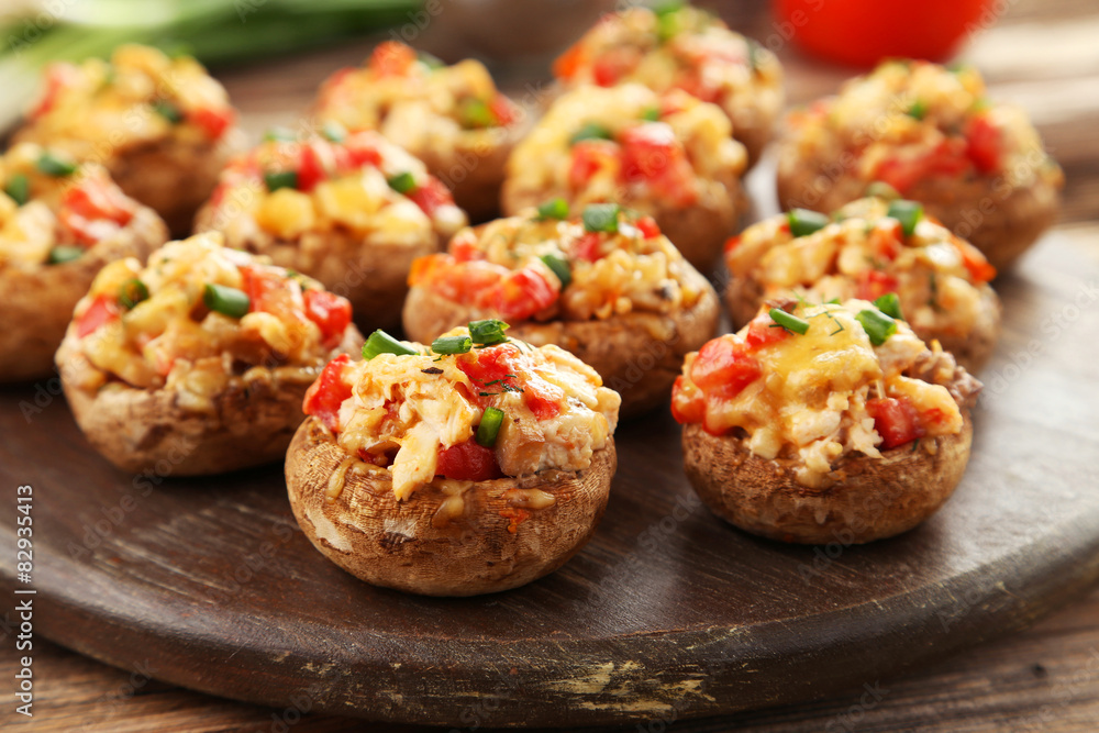 Stuffed mushrooms on cutting board Stuffed mushrooms on cutting board