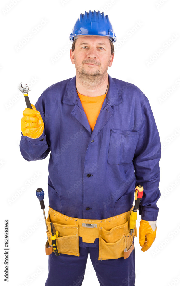 Worker in hard hat holding wrench. Worker in hard hat holding wrench.