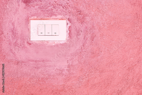Old Switch on pink cement wall © sarayuth3390