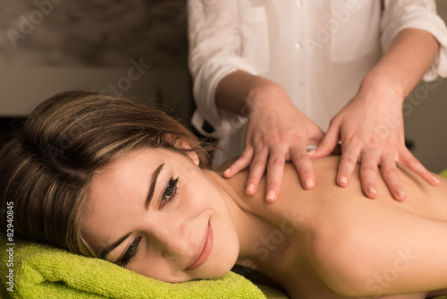 Woman having back massage