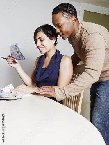 Couple viewing coupons together photo