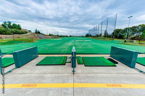 Golf driving range stations above ground