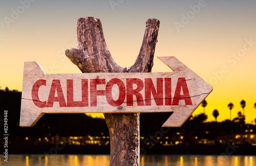 California wooden sign with sunset background photo