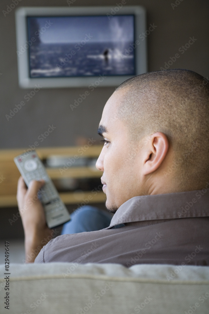 African American man watching television African American man watching television