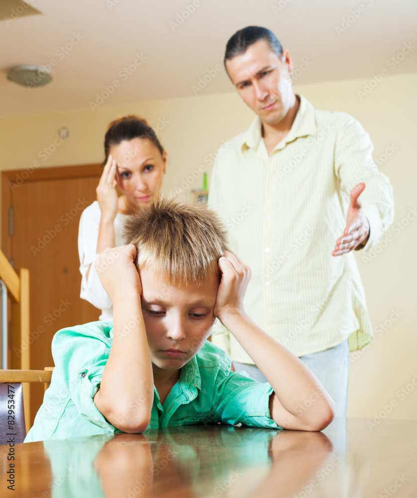 Fototapeta premium Ordinary family of three with teenage son having conflict