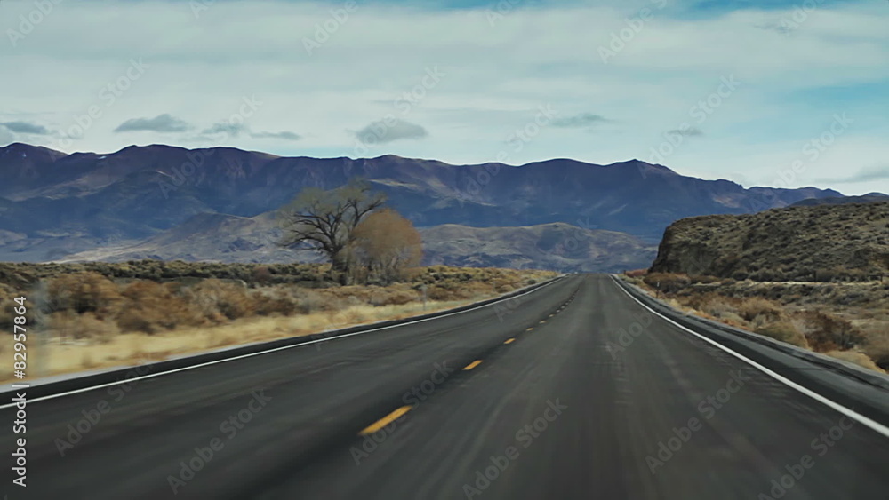 Cinematic road trip travels down a barren and desolate. Cinematic road trip travels down a barren and desolate.