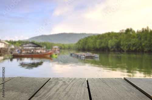 Defocused and blur image of terrace wood and beautiful seascape