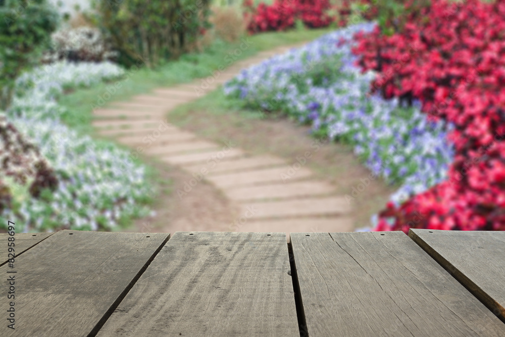 Defocused and blur image of terrace wood and pathway in the park
