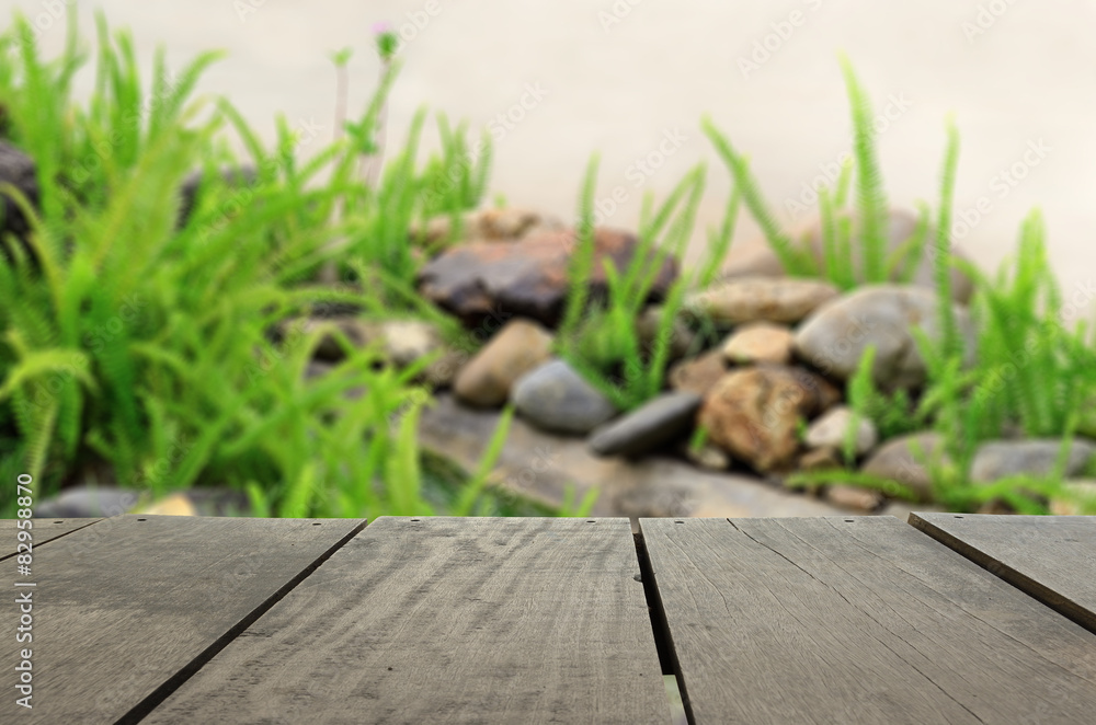Defocused and blur image of terrace wood and beautiful garden fo Defocused and blur image of terrace wood and beautiful garden fo