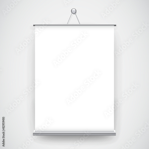 Empty white roll up banner hanging on the wall