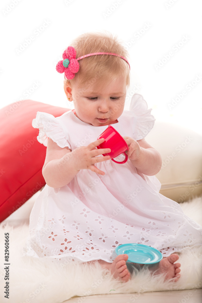 Pretty girl playing with cup toy Pretty girl playing with cup toy