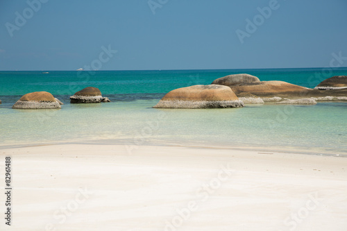 Sandy beach  green sea and blue sky