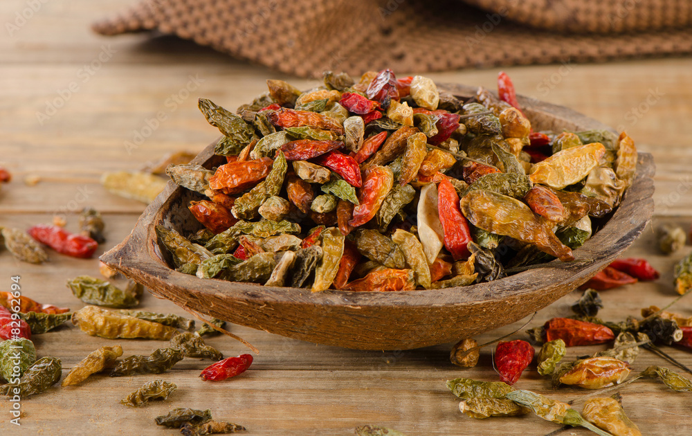 Chili peppers on a old rustic wooden board. Chili peppers on a old rustic wooden board.