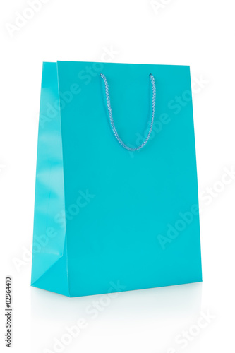 Blue shopping bag in paper isolated on white, clipping path