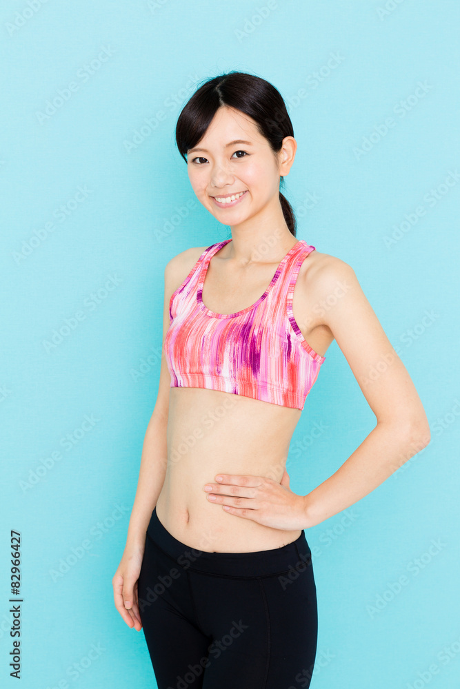 attractive asian woman on blue background attractive asian woman on blue background