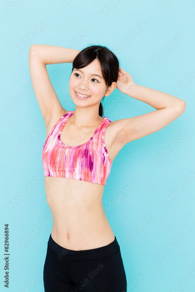 Fototapeta premium attractive asian woman on blue background