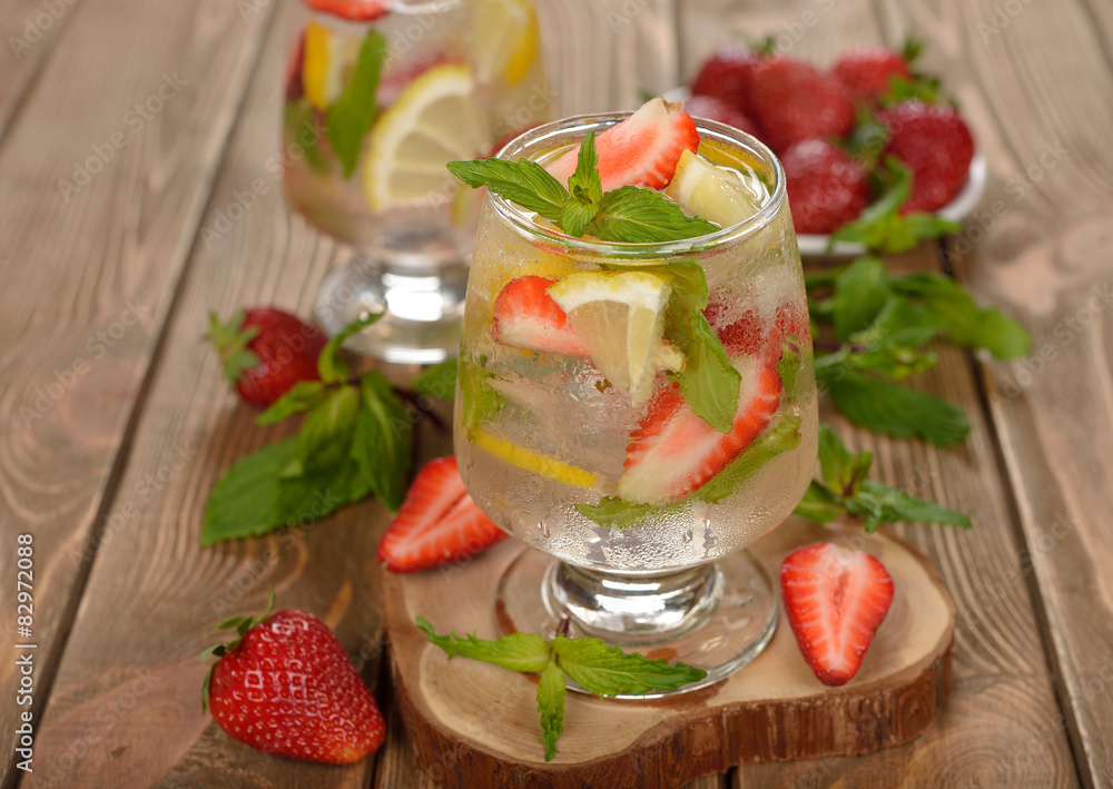 Cold drink with strawberries, lemon and mint Cold drink with strawberries, lemon and mint