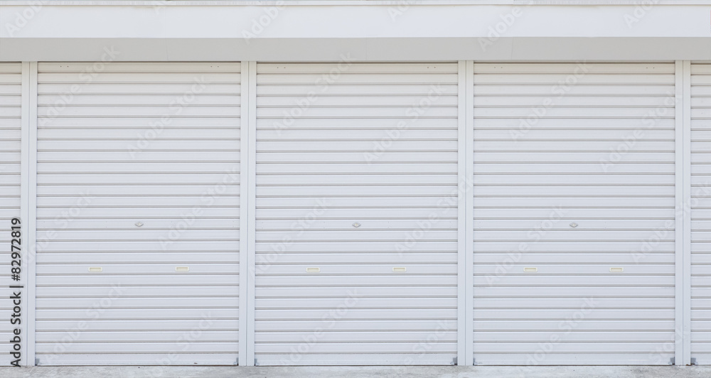 Exterior of white storage unit or small warehouse for rental . Exterior of white storage unit or small warehouse for rental .