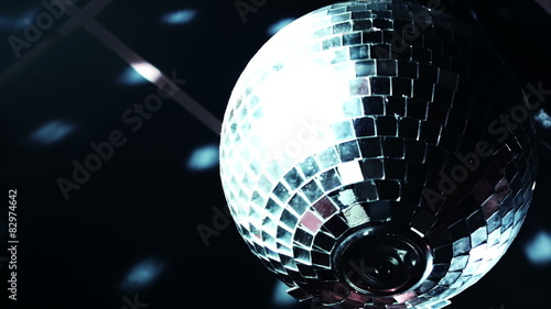 Discoball mirrorball spinning reflecting light into a club venue photo