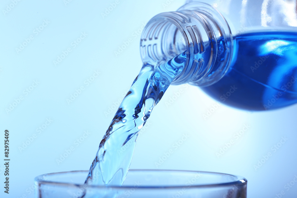 Pouring water on light background Pouring water on light background