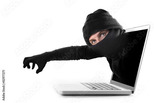 hacker stealing hand out of computer cyber crime concept