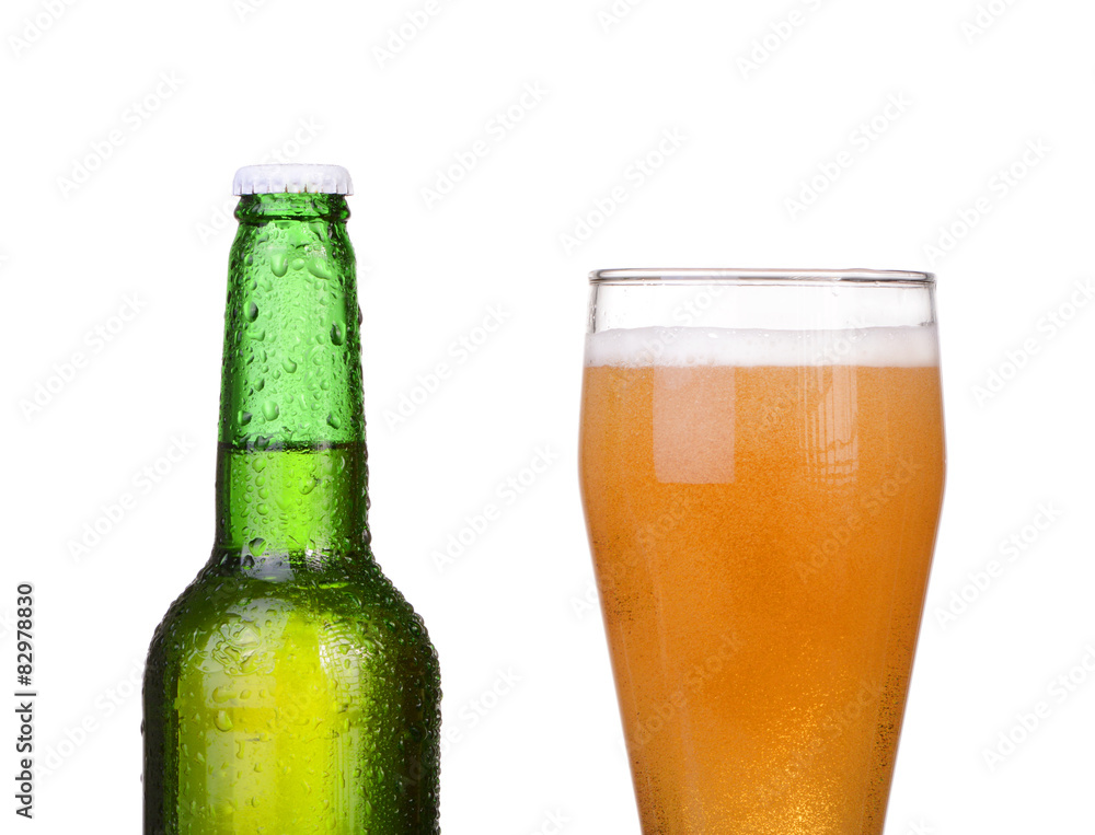 Chilled green bottle with condensate and a glass of beer lager Chilled green bottle with condensate and a glass of beer lager