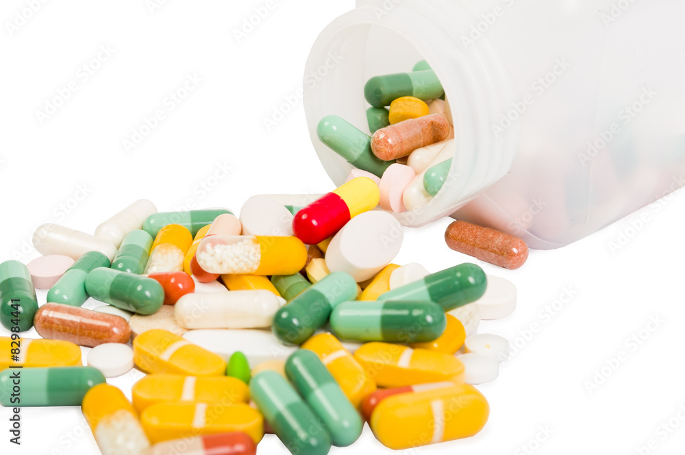 Closeup of spilled pills and bottle Closeup of spilled pills and bottle