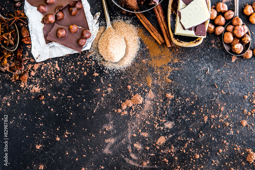 chocolate, cocoa and various spices on table