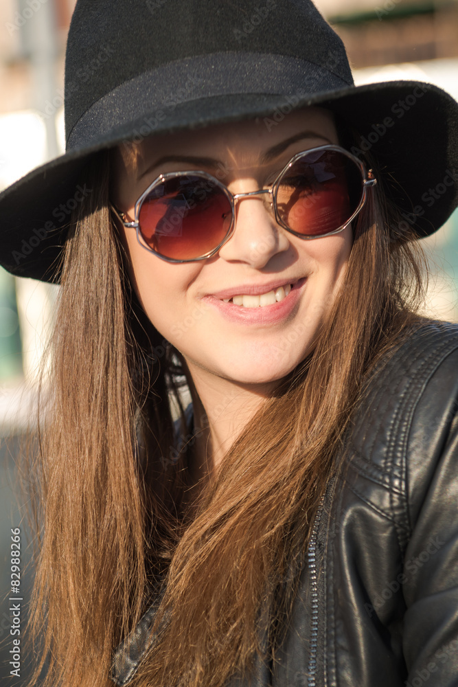 Beautiful attractive girl in a hat and glasses. Beautiful attractive girl in a hat and glasses.