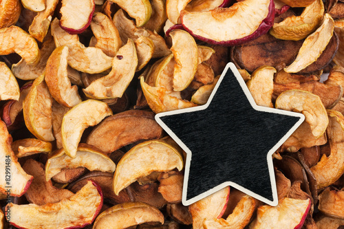 Star, pointer, price, tag, lies on dried  apple