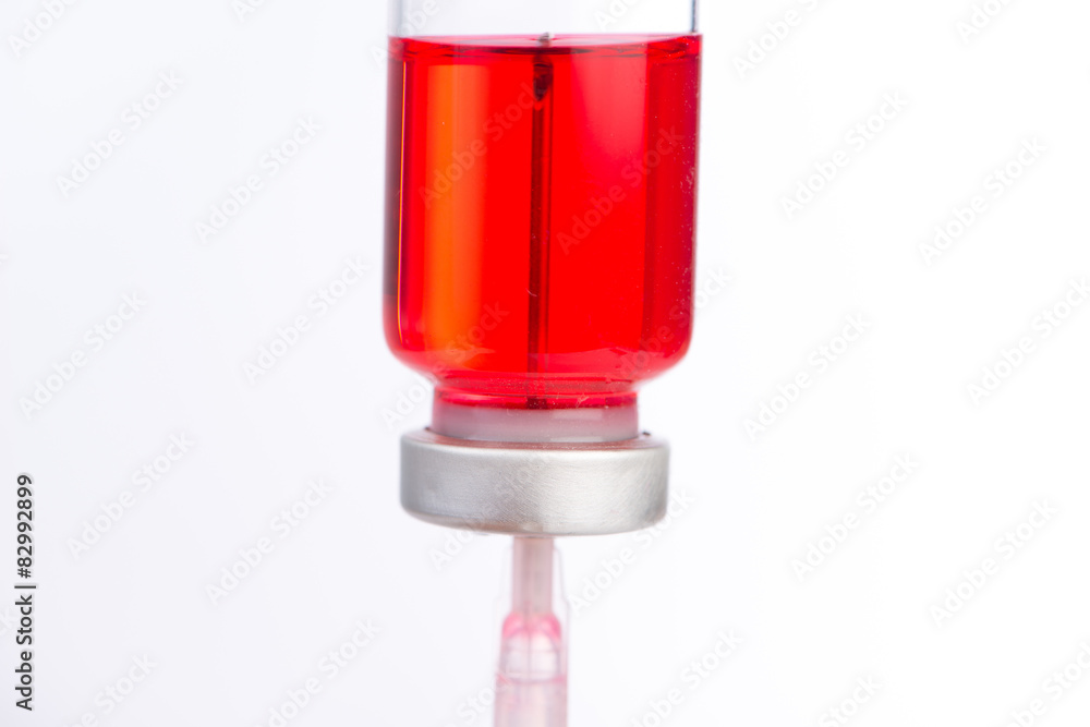 Injection syringe put in medicine vial show medicine concept