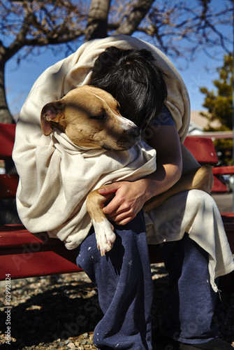 Homeless Man with Dog on Bench