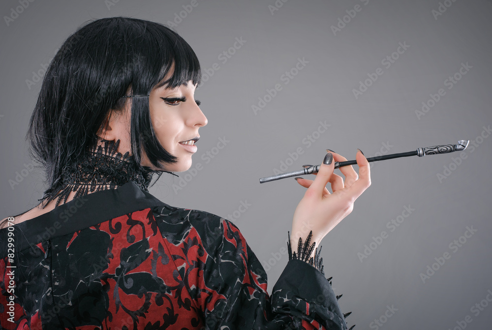Obraz premium Attractive and sexy lady with cigarette holder