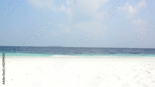 Sand beach and ocean wave, South Male Atoll. Maldives photo