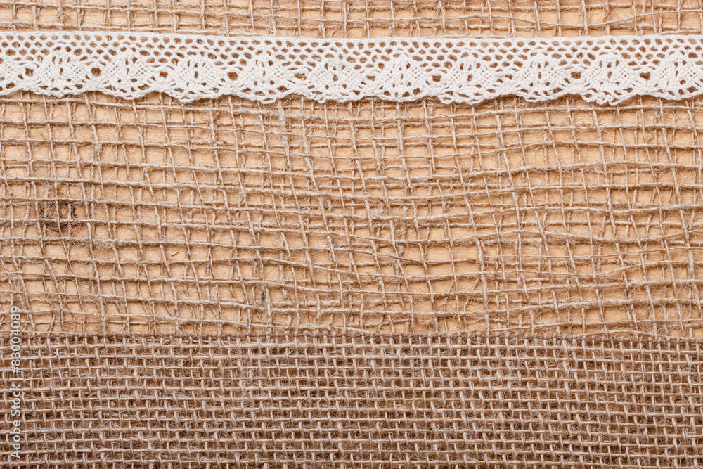 Lace ribbon on burlap cloth background Stock Photo | Adobe Stock